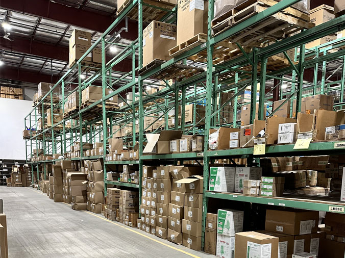 Shelves stocked with plumbing and HVAC supplies at McDonald Supply Dubuque